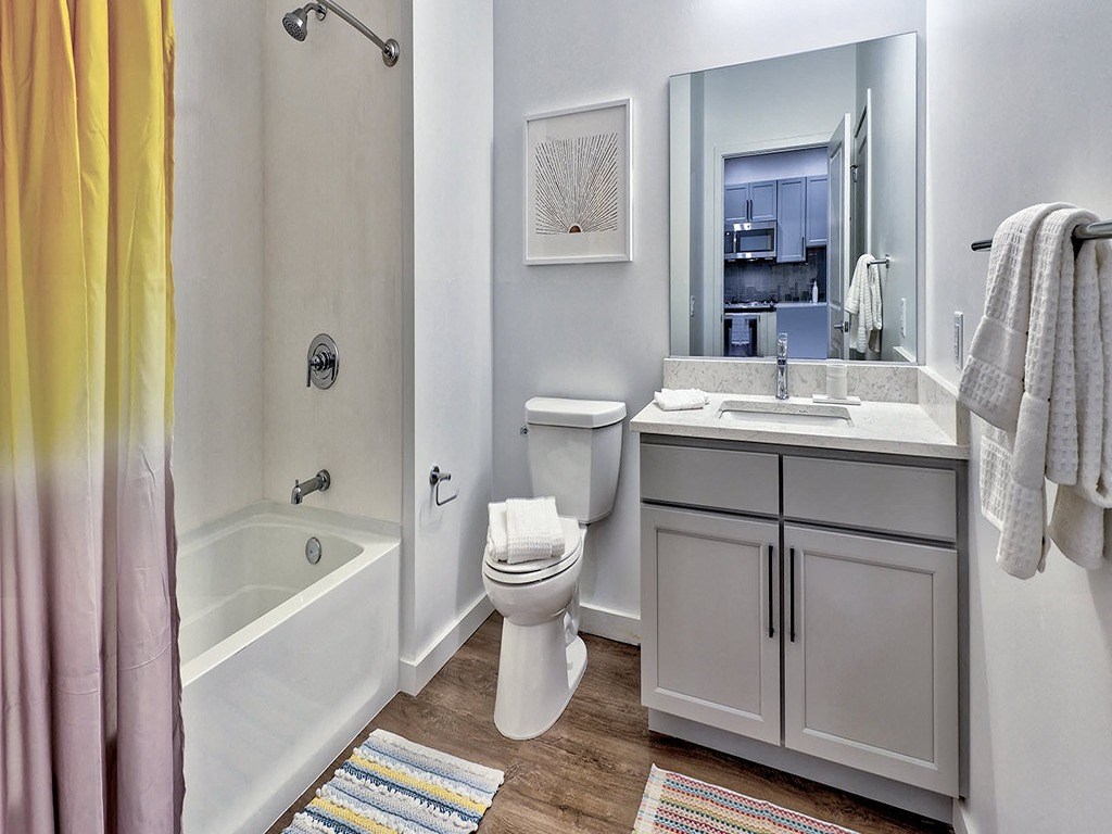 a bathroom with a sink toilet and a bath tub